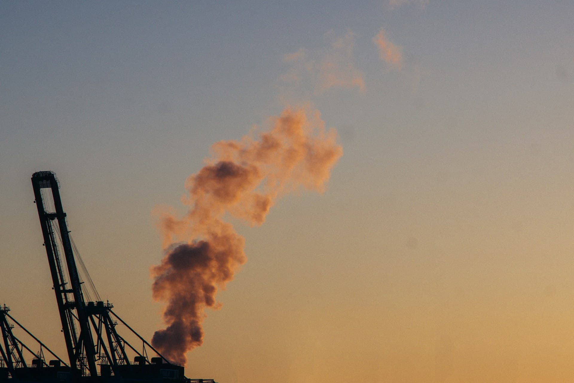Dark smoke rising from ship